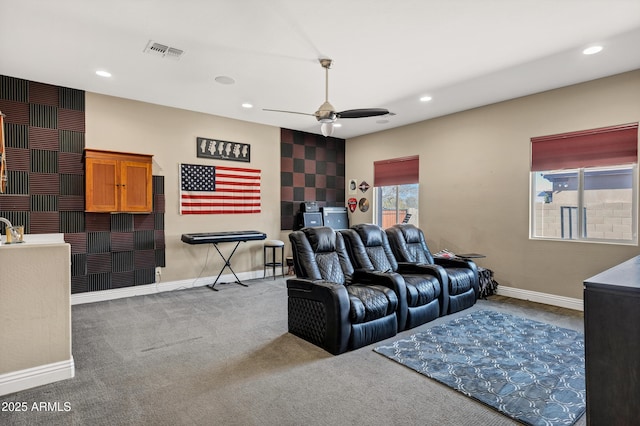 cinema featuring ceiling fan and carpet floors