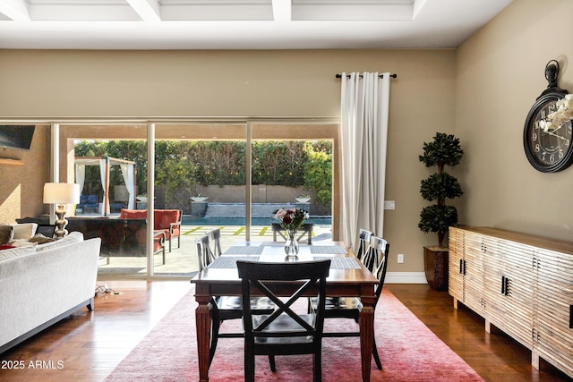 dining area featuring plenty of natural light and dark hardwood / wood-style floors