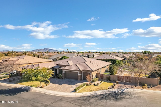 birds eye view of property with a mountain view