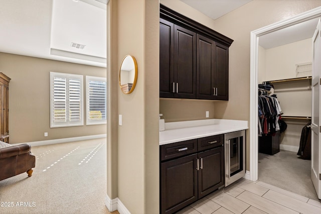 interior space featuring light carpet and beverage cooler