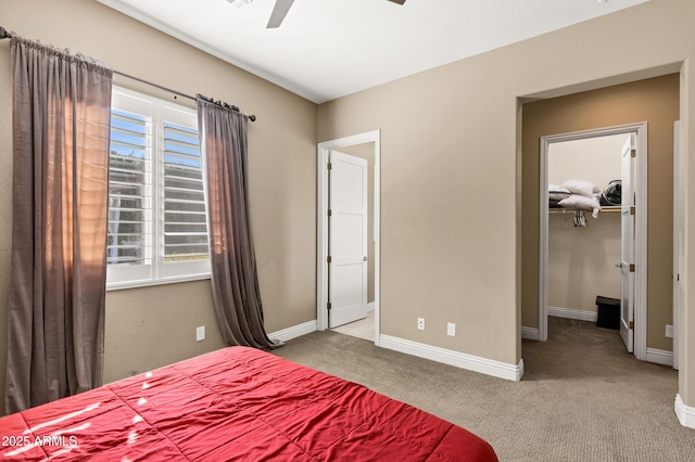 bedroom with multiple windows, light carpet, and ceiling fan