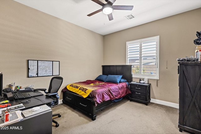 bedroom with light colored carpet and ceiling fan