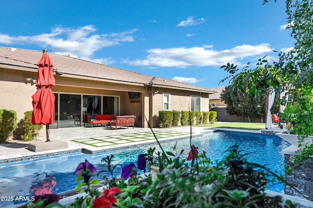 view of pool with an outdoor hangout area and a patio area