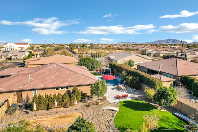 birds eye view of property featuring a mountain view