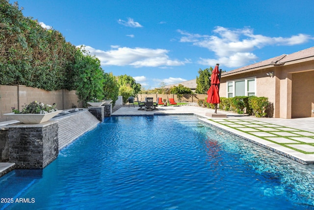 view of swimming pool with a patio area