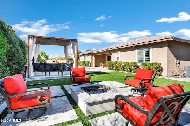 view of patio / terrace featuring an outdoor fire pit