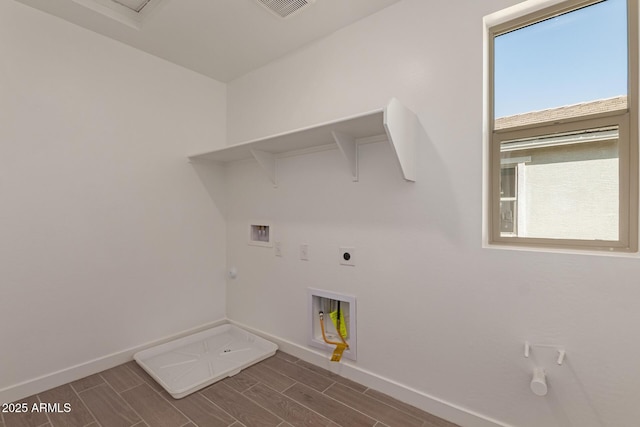 washroom with laundry area, hookup for a gas dryer, hookup for a washing machine, wood tiled floor, and hookup for an electric dryer