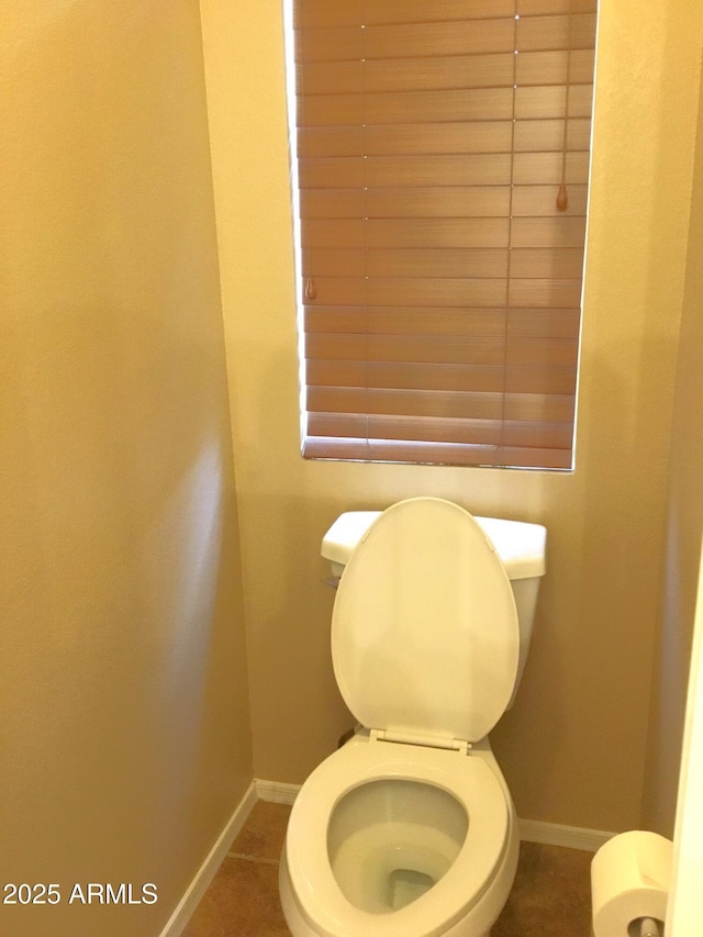 bathroom featuring tile patterned flooring and toilet