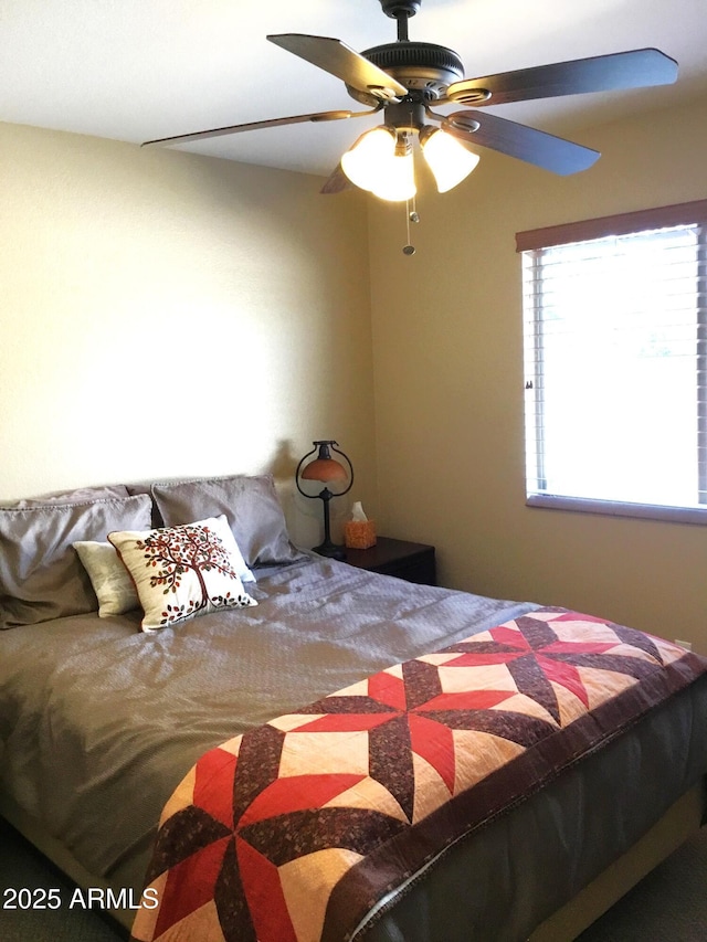 bedroom featuring ceiling fan