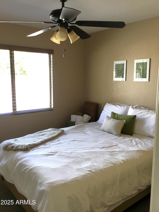 bedroom featuring ceiling fan