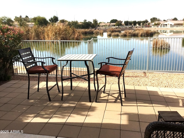 balcony with a patio and a water view