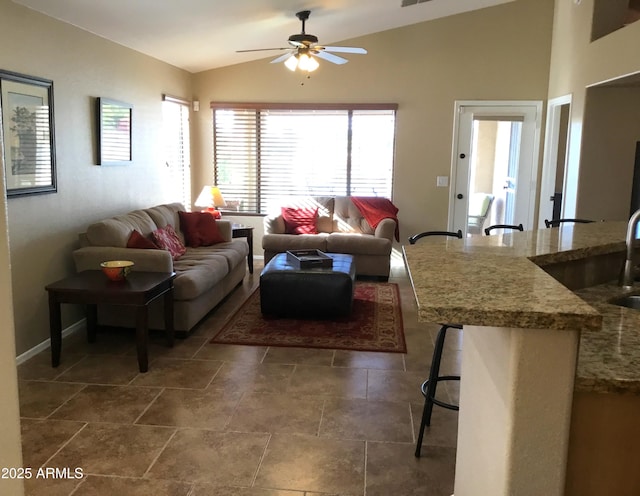 living room featuring lofted ceiling and ceiling fan