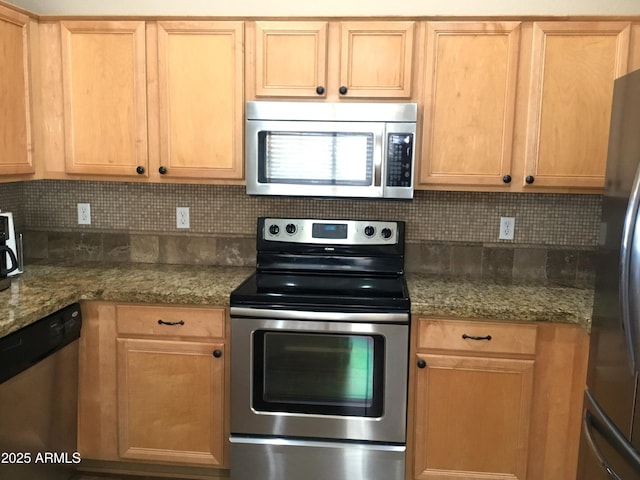 kitchen featuring appliances with stainless steel finishes, light brown cabinetry, backsplash, and light stone countertops