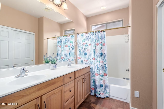 bathroom featuring shower / bath combo and vanity