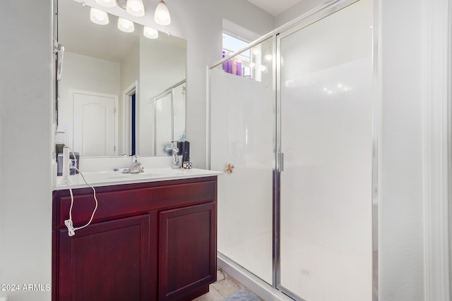 bathroom with vanity and walk in shower