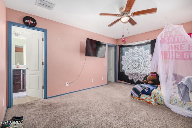 unfurnished bedroom with carpet floors, ceiling fan, and connected bathroom