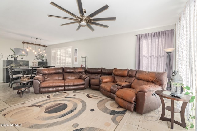 tiled living room featuring ceiling fan