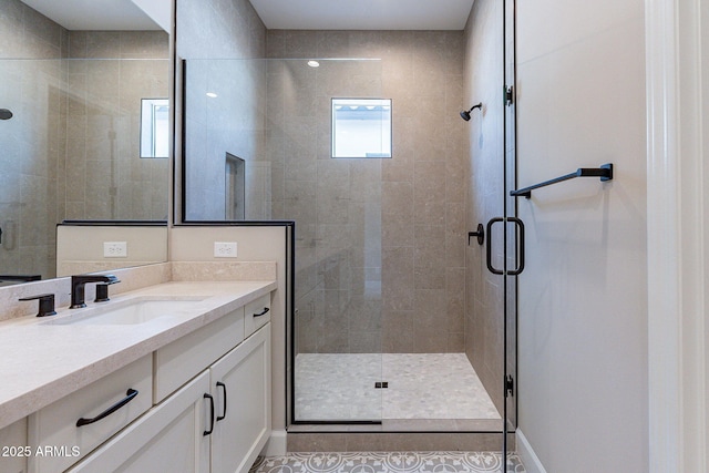 bathroom featuring a shower stall and vanity