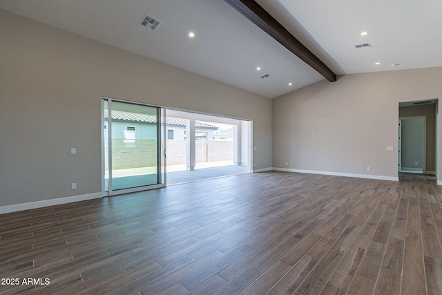 unfurnished room with lofted ceiling with beams, wood finished floors, visible vents, and baseboards