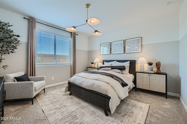 carpeted bedroom with baseboards