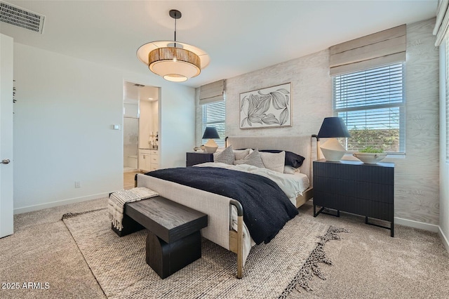 bedroom with baseboards, multiple windows, carpet floors, and visible vents