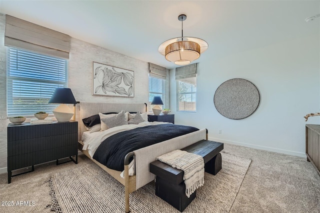 bedroom featuring carpet flooring and baseboards