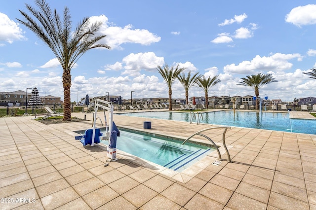 community pool featuring a patio area