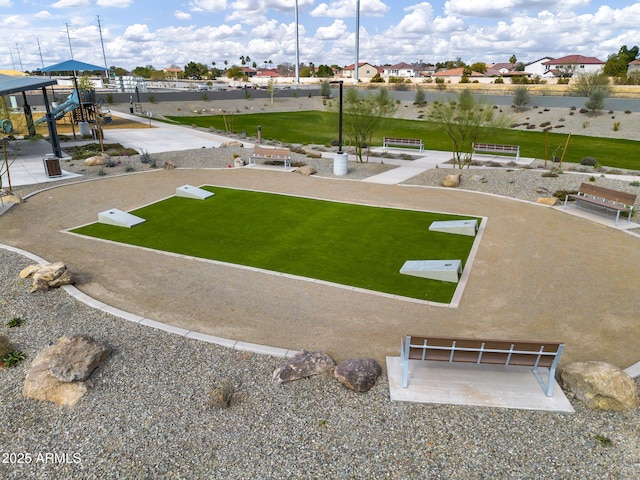surrounding community featuring a lawn and a residential view