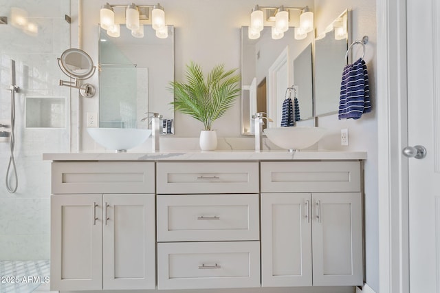 bathroom featuring vanity and a tile shower