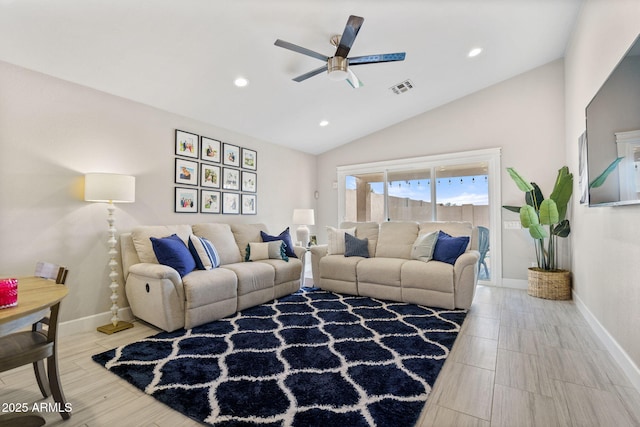 living room with ceiling fan, wood-type flooring, and vaulted ceiling