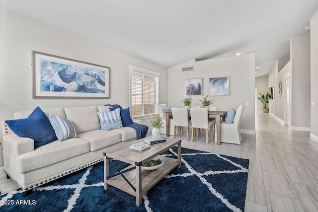 living room with lofted ceiling