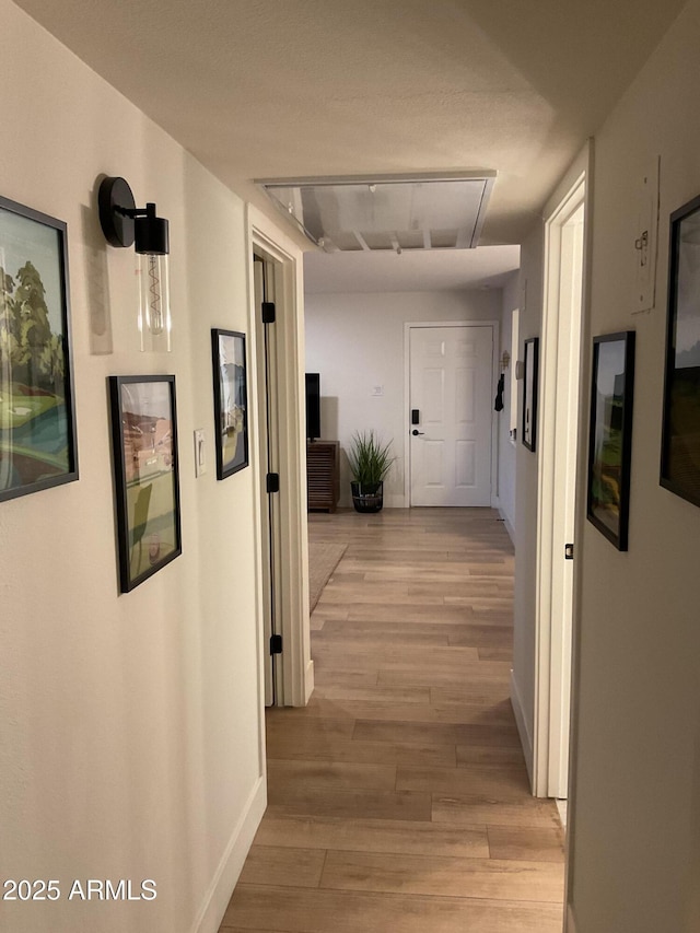 hall with light wood-type flooring