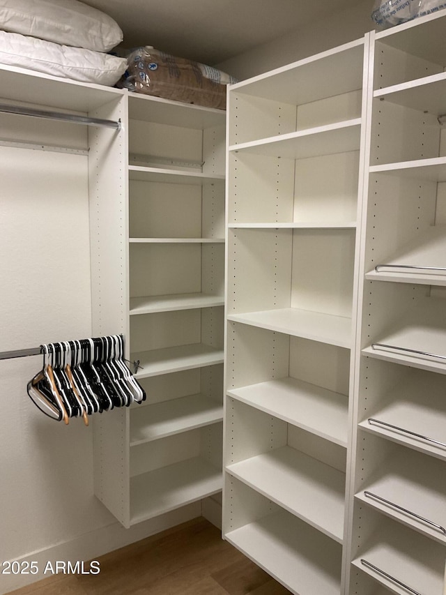 walk in closet featuring hardwood / wood-style floors