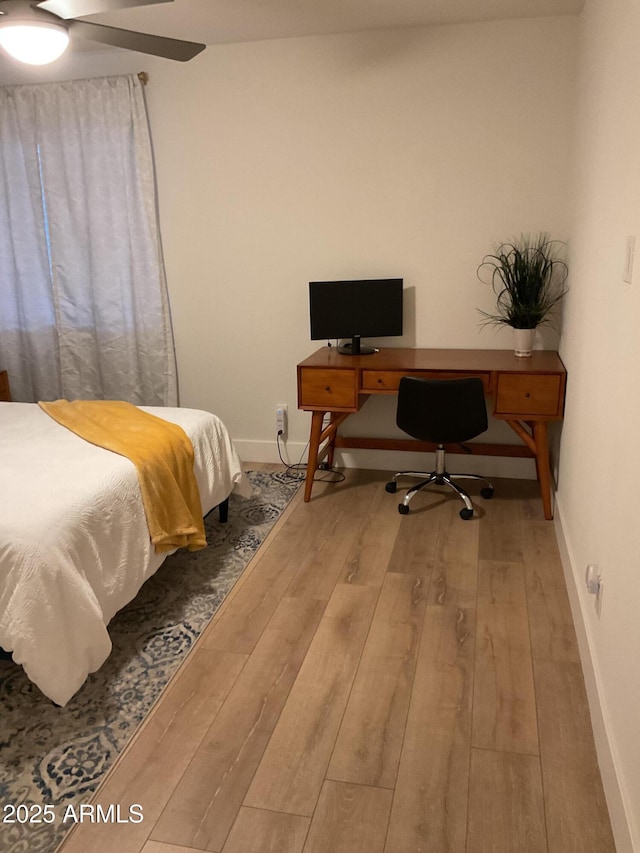 bedroom featuring hardwood / wood-style flooring and ceiling fan