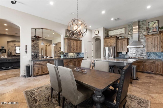 dining area with a chandelier and sink