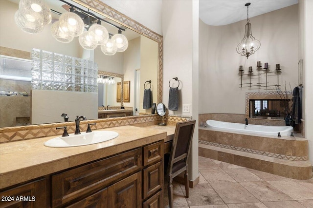 bathroom featuring vanity and a relaxing tiled tub