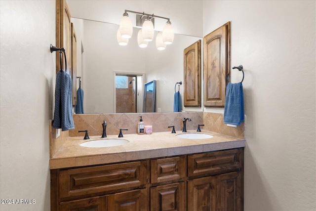 bathroom with tasteful backsplash and vanity