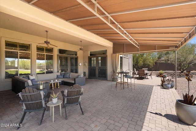 view of patio with outdoor lounge area and ceiling fan