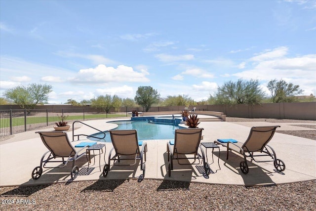 view of swimming pool featuring a patio area