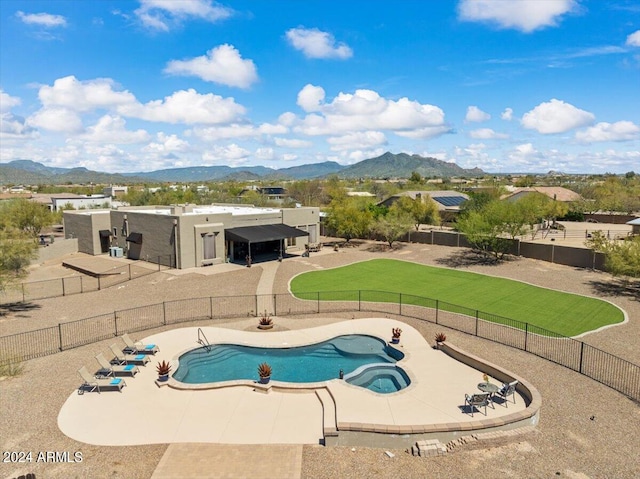 view of swimming pool featuring a mountain view and a patio area