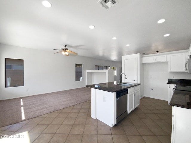 kitchen featuring a center island with sink, white cabinetry, appliances with stainless steel finishes, ceiling fan, and sink