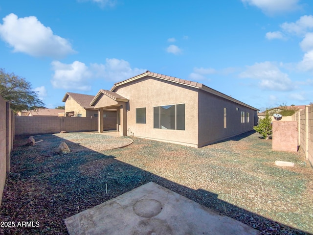 back of house featuring a patio area