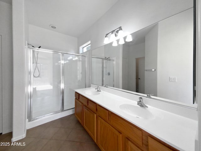 bathroom featuring vanity, walk in shower, and tile patterned flooring