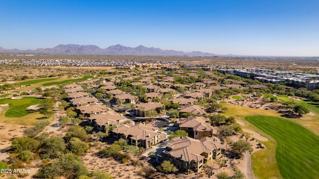 birds eye view of property with a mountain view