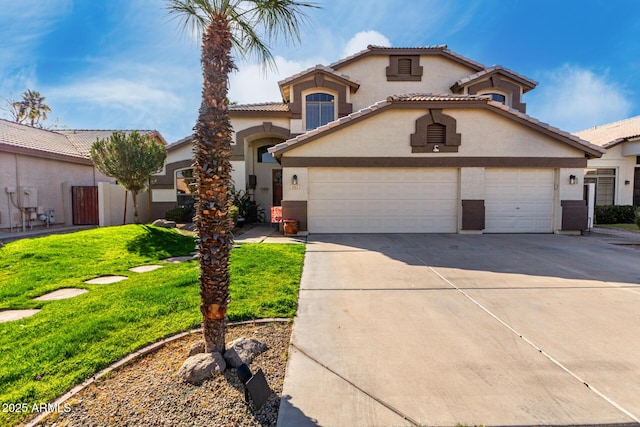 mediterranean / spanish-style house featuring a garage and a front yard