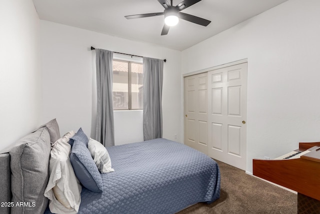 carpeted bedroom featuring ceiling fan and a closet