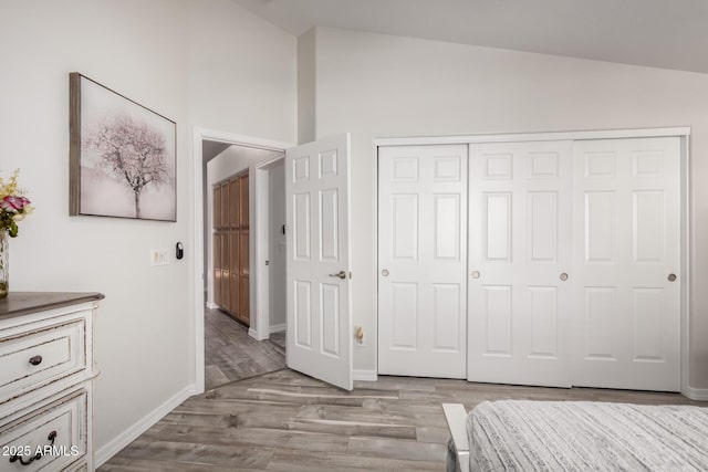 unfurnished bedroom featuring light hardwood / wood-style floors and a closet