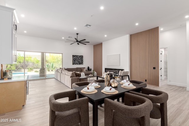 dining room with light wood-style floors, recessed lighting, and a ceiling fan