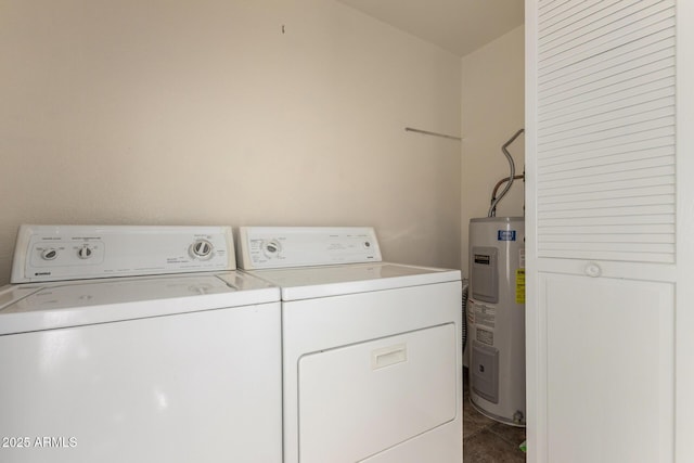 laundry room with laundry area, water heater, tile patterned flooring, and washer and clothes dryer