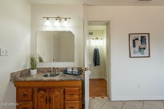 bathroom featuring tile patterned flooring, visible vents, toilet, and vanity